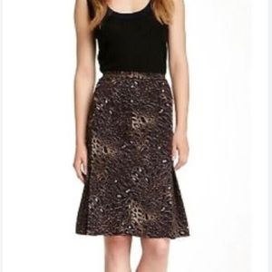 Tory Burch animal print skirt with navy brown and beige print.